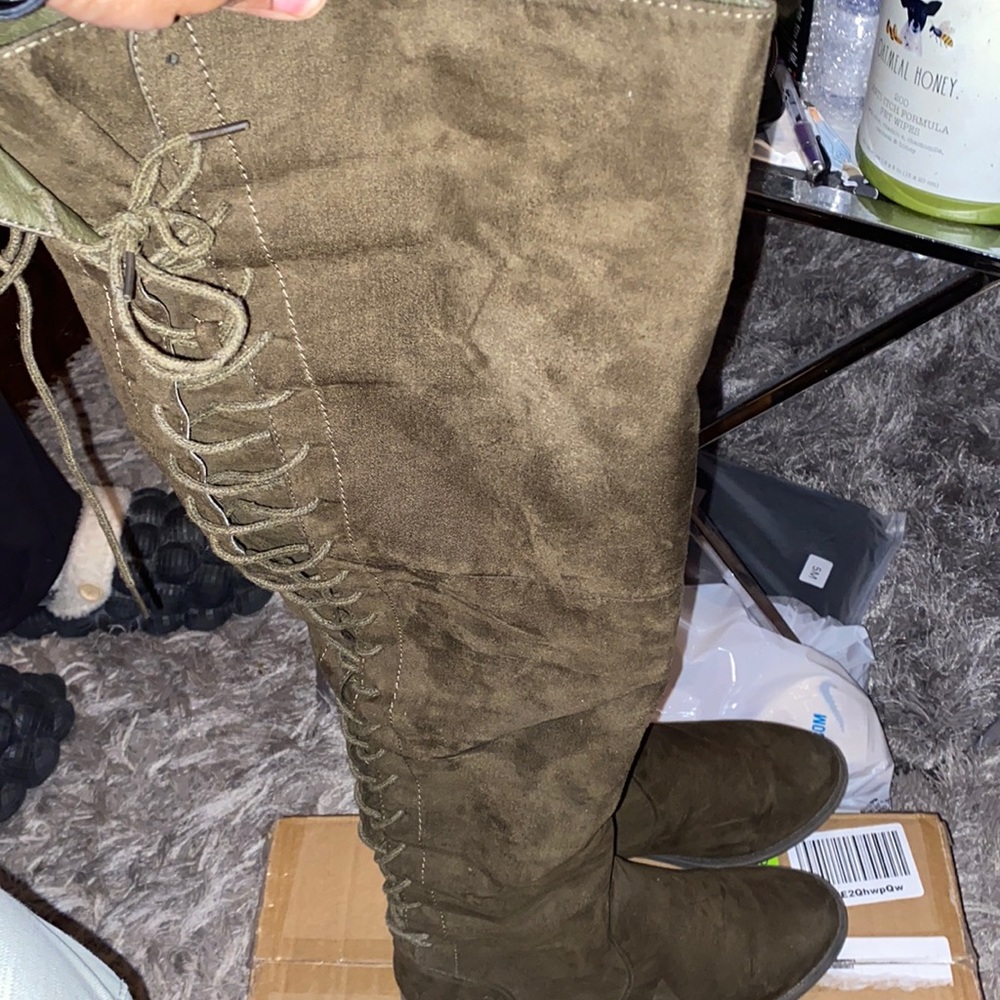 Olive green wide width and wide calf thigh high boots.